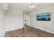This bedroom is spacious, with a ceiling fan and modern wood flooring at 4042 Keefe Falls Ct, North Las Vegas, NV 89085