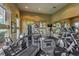 Well-equipped gym featuring modern exercise machines, large windows, and ample natural light for a healthy workout at 4042 Keefe Falls Ct, North Las Vegas, NV 89085