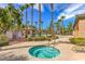 Relaxing hot tub area with nearby pool and landscaping, offering a serene and private setting at 4042 Keefe Falls Ct, North Las Vegas, NV 89085