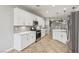 Bright kitchen featuring white cabinetry, stainless steel appliances, and tile flooring at 4042 Keefe Falls Ct, North Las Vegas, NV 89085
