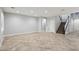 Spacious living room with tile flooring and staircase at 4042 Keefe Falls Ct, North Las Vegas, NV 89085