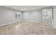 Large living room with tile flooring, neutral paint, and natural light at 4042 Keefe Falls Ct, North Las Vegas, NV 89085