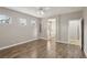 The bright primary bedroom with wood floors connects to a luxurious bathroom at 4042 Keefe Falls Ct, North Las Vegas, NV 89085