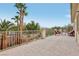 Outdoor patio area with iron railing, outdoor seating, palm trees and views at 4042 Keefe Falls Ct, North Las Vegas, NV 89085