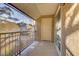 Balcony with neutral toned privacy screen, patio furniture, and sliding glass door at 4310 Sandy River Dr # 70, Las Vegas, NV 89103