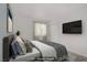 Bedroom featuring a bed, large window, and mounted TV on the wall at 4310 Sandy River Dr # 70, Las Vegas, NV 89103