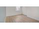 Bedroom with wood flooring, white walls, and a window with blinds at 4310 Sandy River Dr # 70, Las Vegas, NV 89103