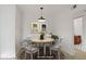 Staged dining room featuring round table, chairs, and decorative art at 4310 Sandy River Dr # 70, Las Vegas, NV 89103