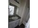 Bathroom featuring a granite countertop and tub at 4645 Fuchsia Nights Ave # 103, North Las Vegas, NV 89084