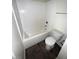 A full tub and toilet are featured in the bathroom at 4645 Fuchsia Nights Ave # 103, North Las Vegas, NV 89084