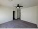 Spacious bedroom featuring neutral walls, ceiling fan, and plush carpeting at 4645 Fuchsia Nights Ave # 103, North Las Vegas, NV 89084