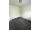 Cozy bedroom featuring plush carpeting, neutral paint, and a standard lighting fixture at 4645 Fuchsia Nights Ave # 103, North Las Vegas, NV 89084