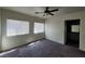 Bedroom featuring two windows and gray carpet flooring at 4645 Fuchsia Nights Ave # 103, North Las Vegas, NV 89084