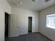 Cozy bedroom with gray carpet and closet space at 4645 Fuchsia Nights Ave # 103, North Las Vegas, NV 89084