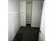 Walk-in closet with multiple shelves and hanging rods for organized storage at 4645 Fuchsia Nights Ave # 103, North Las Vegas, NV 89084