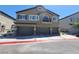 Two-story townhouse with a three-car garage and balcony on the second level at 4645 Fuchsia Nights Ave # 103, North Las Vegas, NV 89084