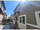 View of the front exterior, showcasing the entrance and windows of a two-story townhouse at 4645 Fuchsia Nights Ave # 103, North Las Vegas, NV 89084