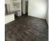 This living room offers hardwood flooring and leads to the kitchen area at 4645 Fuchsia Nights Ave # 103, North Las Vegas, NV 89084
