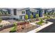 Aerial view of a community playground with modern homes and community amenities at 4839 Orchid Ridge Ave # 96, Las Vegas, NV 89141