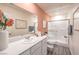 Bathroom featuring a white vanity, large mirror, and a glass-enclosed shower at 4839 Orchid Ridge Ave # 96, Las Vegas, NV 89141