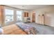 Cozy bedroom featuring neutral tones, carpet, a comfy chair, and stylish furnishings at 4839 Orchid Ridge Ave # 96, Las Vegas, NV 89141