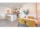 Open concept dining area, modern kitchen, stainless steel appliances, and bar seating at 4839 Orchid Ridge Ave # 96, Las Vegas, NV 89141