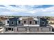 New townhome exterior showcasing modern architecture, private garages, and neutral color palette at 4839 Orchid Ridge Ave # 96, Las Vegas, NV 89141