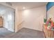 Upstairs hallway with staircase and view of cabinet with mirror at 4839 Orchid Ridge Ave # 96, Las Vegas, NV 89141