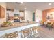 Modern kitchen with stainless steel appliances, granite countertops, white cabinetry and bar seating at 4839 Orchid Ridge Ave # 96, Las Vegas, NV 89141