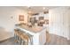Modern kitchen with white cabinets, stainless appliances, granite counters and bar stool seating at 4839 Orchid Ridge Ave # 96, Las Vegas, NV 89141