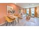 Living area with dining, modern furniture, neutral walls and wood floors at 4839 Orchid Ridge Ave # 96, Las Vegas, NV 89141