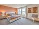 The main bedroom features a large bed with patterned bedding and wood accent furniture at 4839 Orchid Ridge Ave # 96, Las Vegas, NV 89141