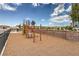 Community playground with climbing structure and safety surfacing, perfect for Gathering fun at 4839 Orchid Ridge Ave # 96, Las Vegas, NV 89141