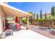 Well-maintained backyard featuring a covered patio and charming landscaping at 5017 Hadley Meadow Ct, Las Vegas, NV 89131