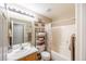 Bright bathroom featuring a vanity with a sink, shelving, and a shower-tub combination at 5017 Hadley Meadow Ct, Las Vegas, NV 89131