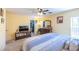 Large bedroom with a walk-in closet, a television, and comfortable furnishings, creating a cozy retreat at 5017 Hadley Meadow Ct, Las Vegas, NV 89131