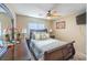Inviting bedroom featuring a bed with decorative pillows and elegant lamps, complemented by a dresser at 5017 Hadley Meadow Ct, Las Vegas, NV 89131