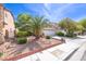 Single-Gathering home features desert landscaping and a two-car garage at 5017 Hadley Meadow Ct, Las Vegas, NV 89131