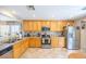 Spacious kitchen with light wooden cabinets, stainless steel appliances, and tile flooring at 5017 Hadley Meadow Ct, Las Vegas, NV 89131