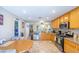 Modern kitchen featuring wooden cabinets, steel appliances, and a seamless flow into dining area at 5017 Hadley Meadow Ct, Las Vegas, NV 89131
