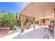 Covered patio with seating and landscaping for outdoor living at 5017 Hadley Meadow Ct, Las Vegas, NV 89131