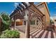 The backyard patio has a pergola, brick floor, and is adjacent to the home at 5239 Tartan Hill Ave, Las Vegas, NV 89141