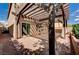 Backyard patio has brick floors, a pergola with lighting, and is adjacent to the home's sliding glass door at 5239 Tartan Hill Ave, Las Vegas, NV 89141