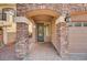 Inviting home entrance showcasing stone pillars, covered entryway, and paver pathway to the front door at 5239 Tartan Hill Ave, Las Vegas, NV 89141