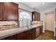 Modern kitchen featuring stainless steel appliances, granite counters, and a bright window at 5239 Tartan Hill Ave, Las Vegas, NV 89141
