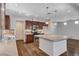 Stylish kitchen features an island, stainless steel appliances, and sleek design at 5239 Tartan Hill Ave, Las Vegas, NV 89141