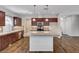 Bright kitchen with central island, granite countertops and stainless steel appliances at 5239 Tartan Hill Ave, Las Vegas, NV 89141