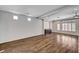 Bright, open living room with hardwood floors, recessed lighting, and lots of natural light at 5239 Tartan Hill Ave, Las Vegas, NV 89141