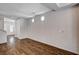 Bright living room with wood floors, neutral walls, and an open layout leading to the front entrance at 5239 Tartan Hill Ave, Las Vegas, NV 89141