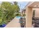 Inviting backyard with a covered patio, string lights, and a small pool perfect for relaxation at 53 Grossinger Ct, Henderson, NV 89074